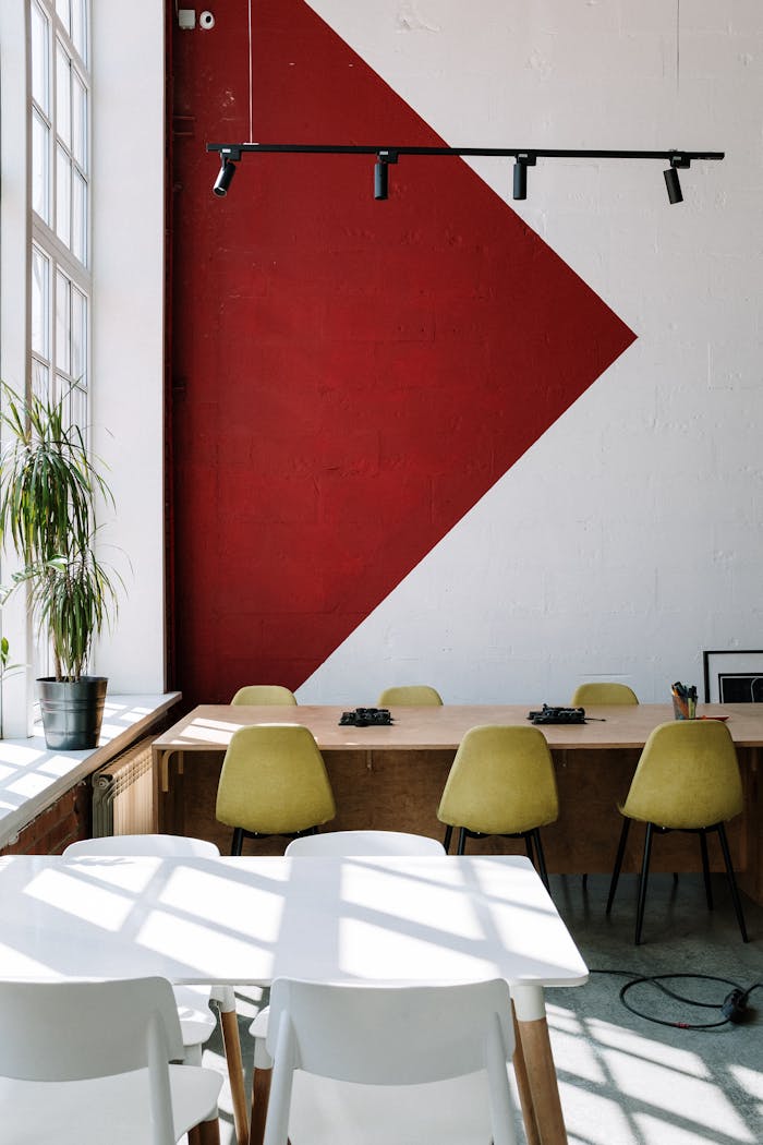 A stylish modern office interior with bright natural light and designer furniture.